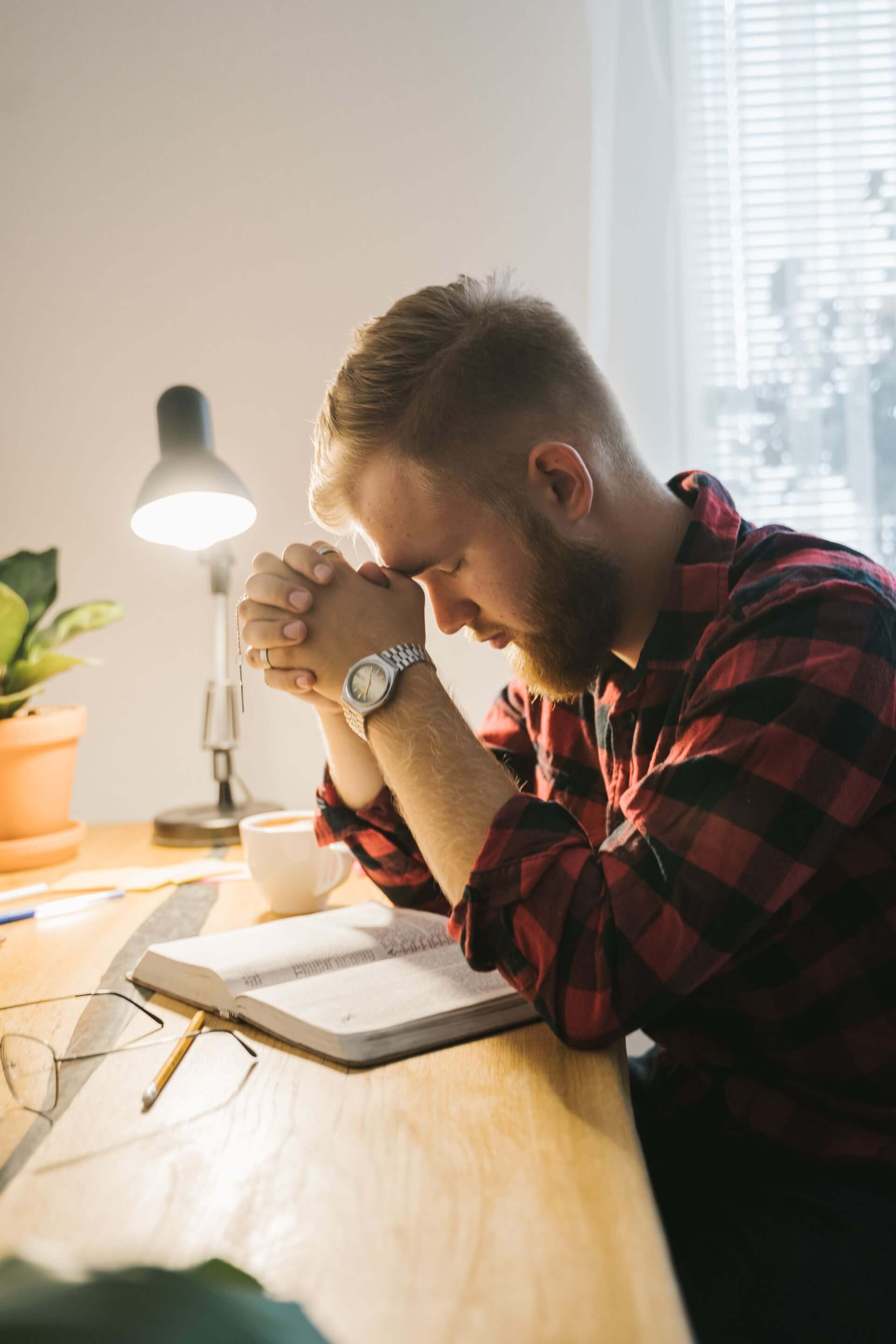 A man in a thoughtful, reflective moment during a counseling session